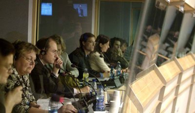 Professional conference interpreters working in interpretation booths